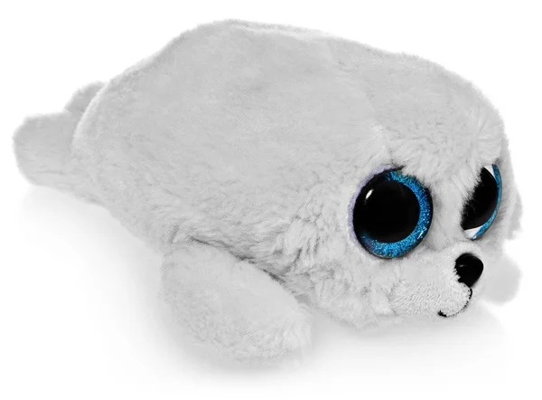 Juguete de peluche, un sello blanco con grandes ojos azules. Mascota peluda, regalo . —  Fotos de Stock