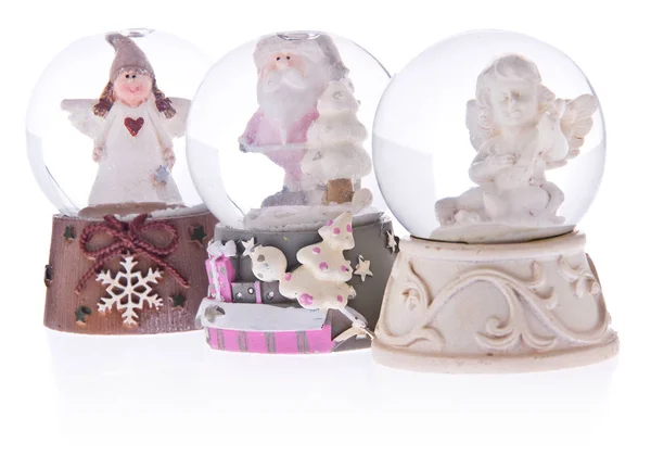 Snow globe with angels, Santa Claus on a ceramic base. — Stock Photo, Image