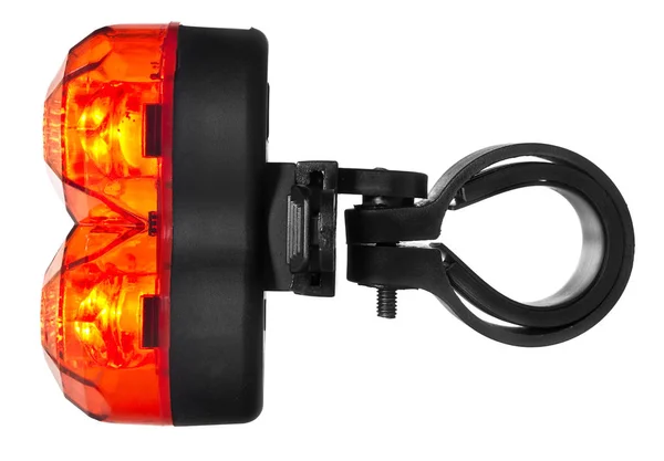 Lámpara de bicicleta trasera iluminada, de plástico en color rojo . —  Fotos de Stock