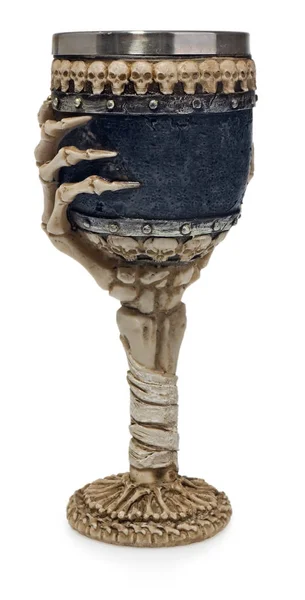 Halloween goblet decorated with skeleton hand and skulls. — Stock Photo, Image