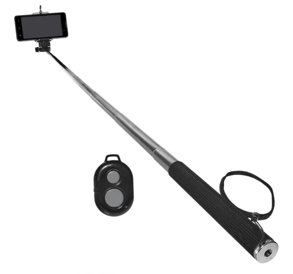 Selfie stick with remote control and smartphone for taking pictu — Stock Photo, Image
