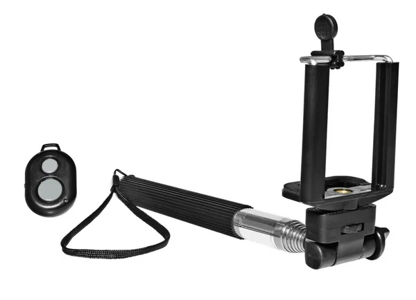 Selfie stick con mando a distancia para tomar fotos y vídeos . Imagen De Stock