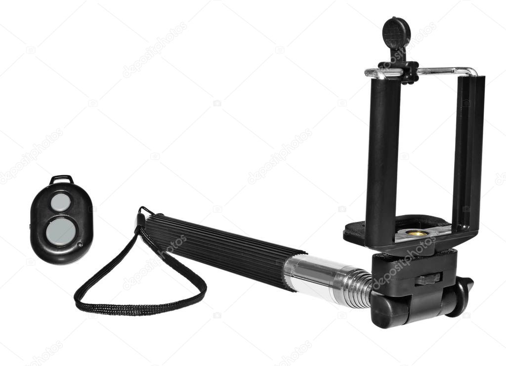 Selfie stick with remote control for taking pictures and videos.