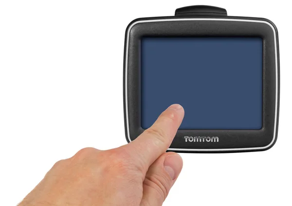 TomTom GPS car navigation with handle. The finger indicates the — Stock Photo, Image