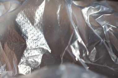 Abstract crumpled white plastic texture background, Close up & Macro shot, Selective focus, transparent concept