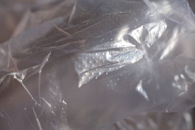 Abstract crumpled white plastic texture background, Close up & Macro shot, Selective focus, transparent concept