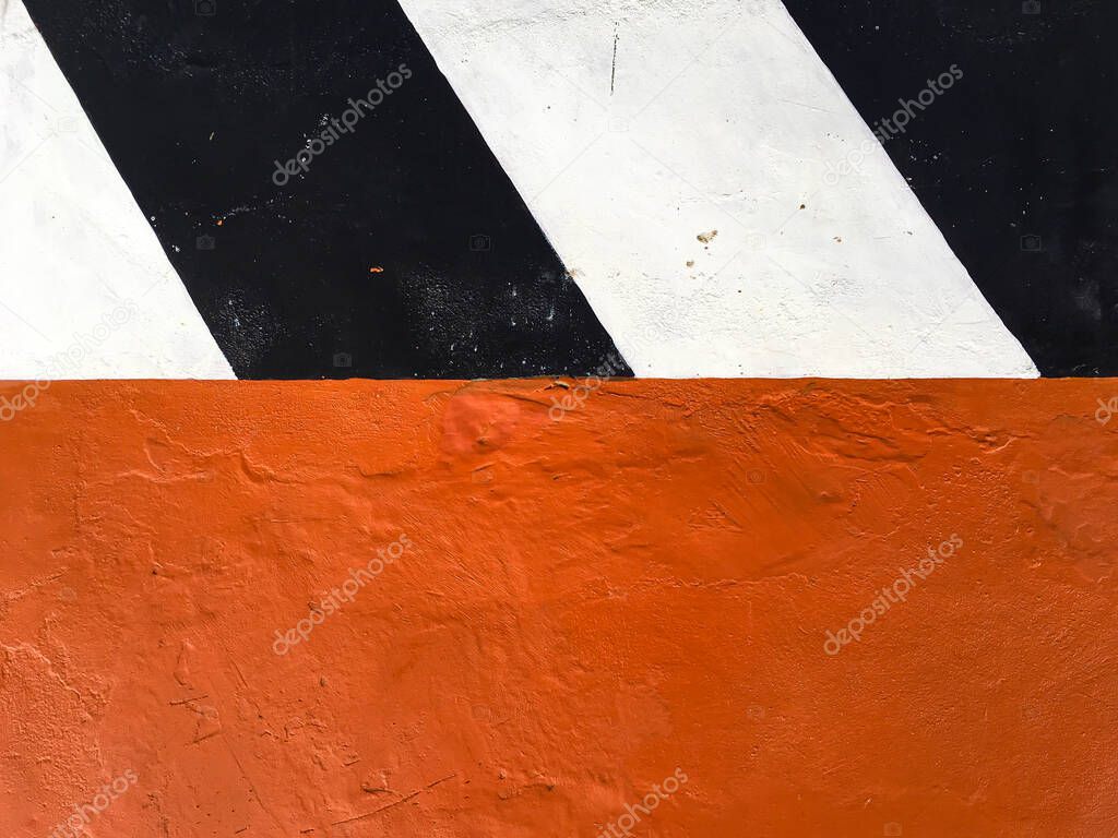 Black and White painted colour striped cement  with Orange painted colour grungy concrete texture background