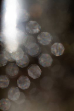 Bokeh blurred cooking oil stained on glass bottle, Light & Shadow shot, Close up and macro shot