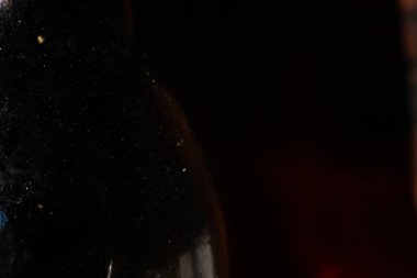 Bokeh blurred cooking oil stained on glass bottle, Light & Shadow shot, Close up and macro shot