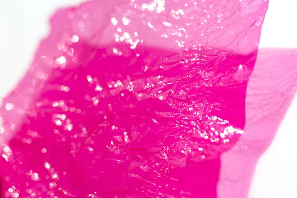 Thin Sheet Pink Colour Cellophane Shiny Crumpled Surface Texture White — Stockfoto