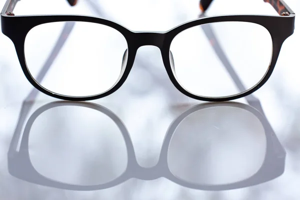 Black Shortsighted Nearsighted Eyeglasses White Acrylic Table Background Close Macro — 스톡 사진