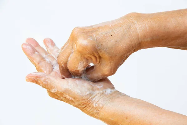 Руки Пожилой Женщины Мыть Руки Помощью Мыла Пены Шаге Белом — стоковое фото