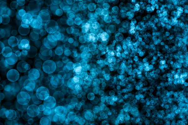 Görüntü Bokeh 'in soyut ışıkları mavi renk, Siyah Arkaplan, Parıltı, Odaklanmamış, Kusursuz polka deseni, Yaratıcı, İllüstrasyon tasarımı