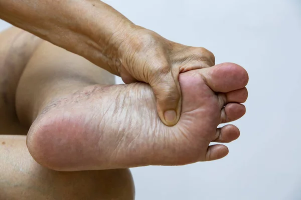 Senior Woman Suffering Left Foot Pain Massaging Her Hand White — Stock Photo, Image