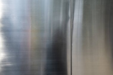 Yansıtıcı paslanmaz çelik, fırçalanmış metal doku arka plan, yakın çekim, seçici odak, endüstriyel konsept