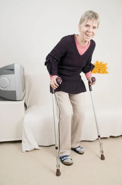 woman happy on crutches