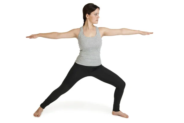 Yoga kvinnan grå ställning Varabhadrasana_front — Stockfoto