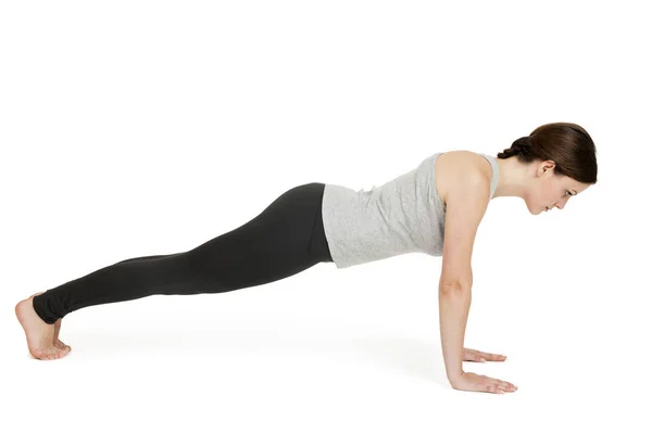 Yoga kvinnan grå position_chaturanga — Stockfoto