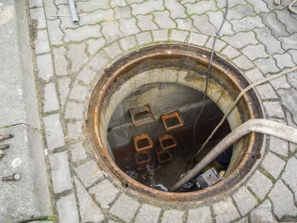 Open Sewer cleaning with hose — 스톡 사진