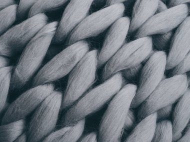 Merinos yün el yapımı örgü büyük battaniye, süper tıknaz iplik, modaya uygun kavram. Örgü battaniye, Merinos yün arka plan Close-Up