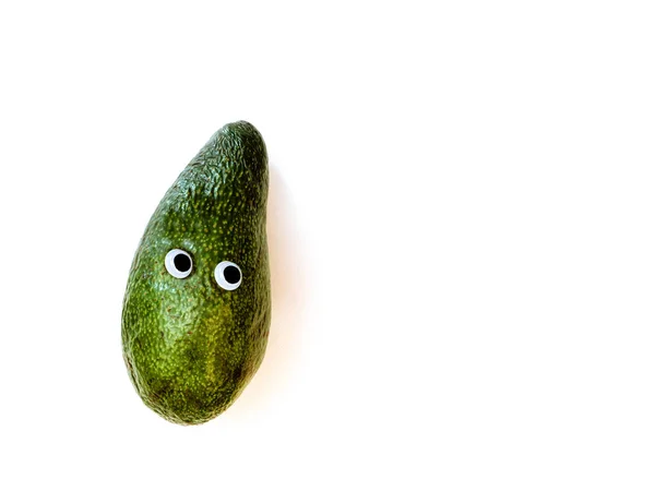 Ugly avocado with googly eyes on white background — Stock Photo, Image