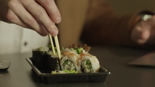 Eating sushi with chopsticks. — Stock Video
