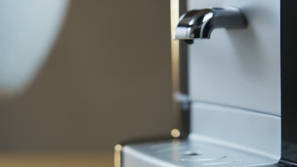 Young Man Puts a Cup Into the Coffee Machine — Stock Video