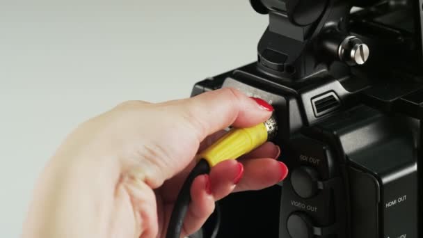 Woman Plugging Yellow Cable Video Camera Cable Plugging Close Shot — Stock Video