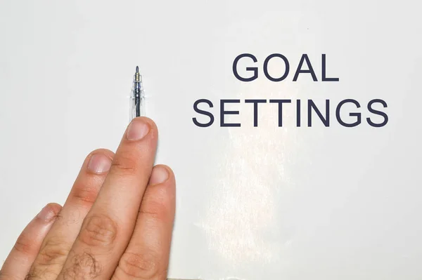 goal settings written on white paper