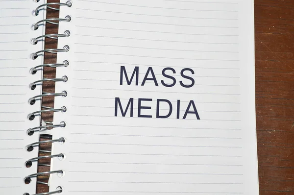 mass media word written on white paper