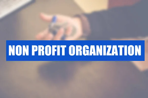 Słowo Organizacji Non Profit Zamazanym Tłem Biznesowym — Zdjęcie stockowe
