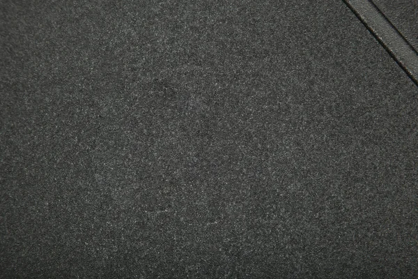 The surface of the grey car mats closeup