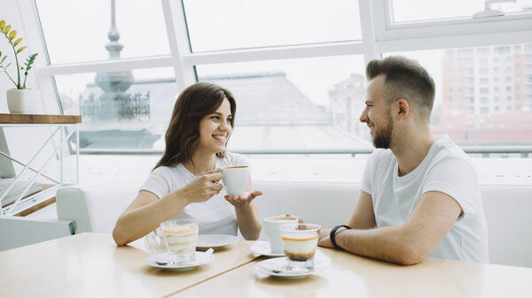 Attractive young couple on a date in a cafe