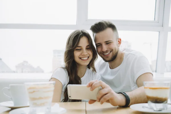 Attractive young couple on a date in a cafe