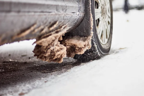 Car covered with snow and ice after a snowfall