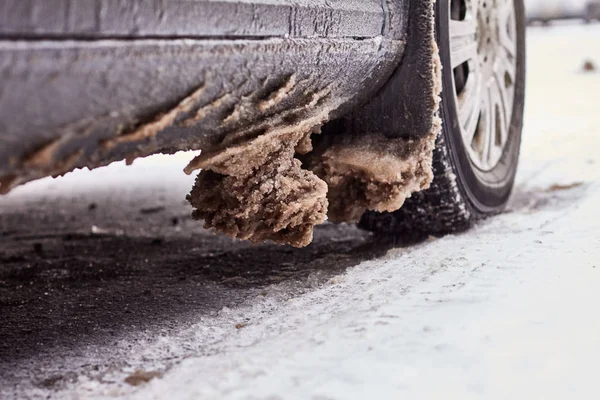 Car covered with snow and ice after a snowfall