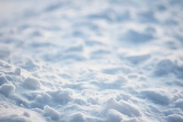 Flat surface ice crust. Texture of light and shadows on snow field.