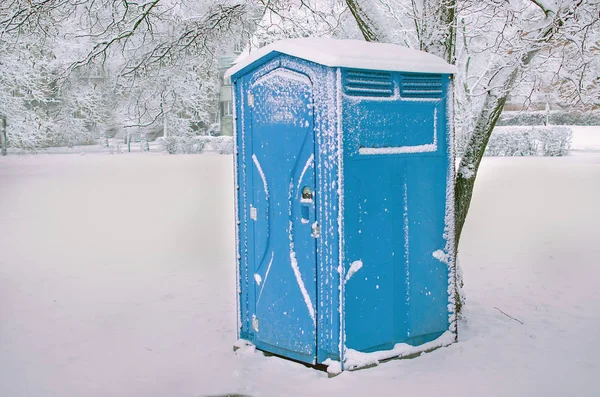 Blue outdoor chemical toilet in the park on winter — Stock Photo, Image