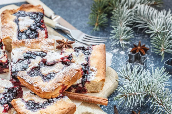 Sweet Christmas berry pie in Christmas decorations