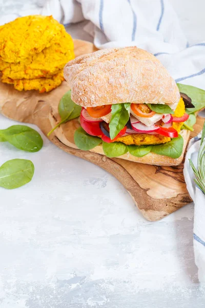 Vegan lentils burger with tofu and vegetables.