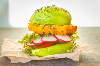 Vegan avocado lentils burger with vegetables clipart
