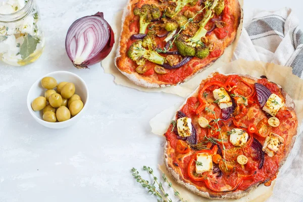 Homemade vegetarian vegetable pizza with feta cheese and broccol