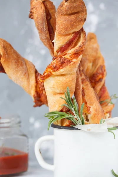 Tasty cheese sticks with bacon, herbs and tomato sauce, macro