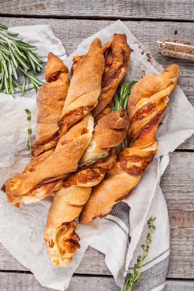 Tasty cheese sticks with bacon, herbs and tomato sauce. — Stock Photo, Image