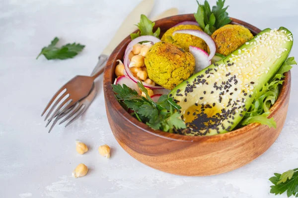 Buddha bowl of vegetable salad with baked falafel and avocado. — Stock Photo, Image