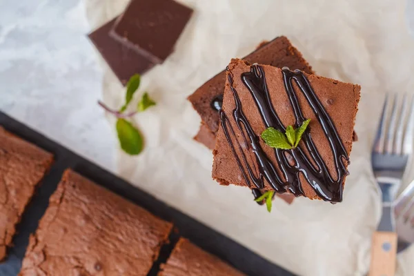 Pieces of healthy vegan pumpkin chocolate brownie with chocolate