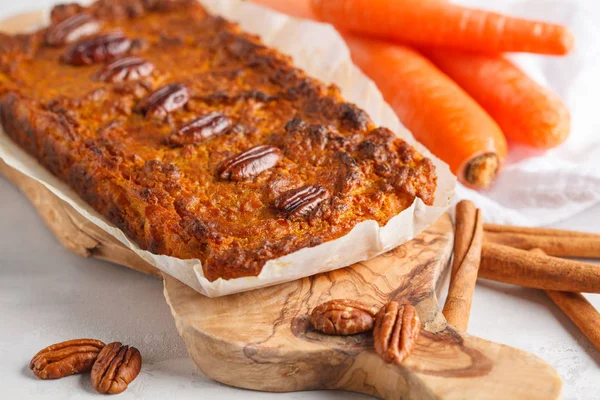 Vegan carrot bread with pecan, light background. Healthy vegan f