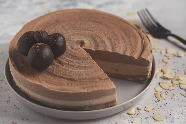 Raw vegan chocolate-caramel cheesecake with raw balls. Healthy v