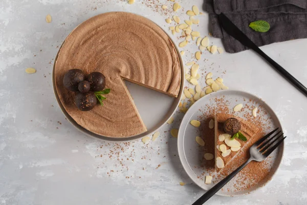 Raw vegan chocolate-caramel cheesecake with raw balls. Healthy v