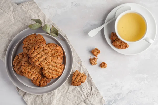 Homemade healthy aquafaba vegan cookies with tea, top view